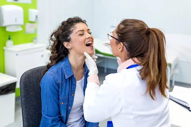 Dentist performing a comprehensive oral examination on a patient